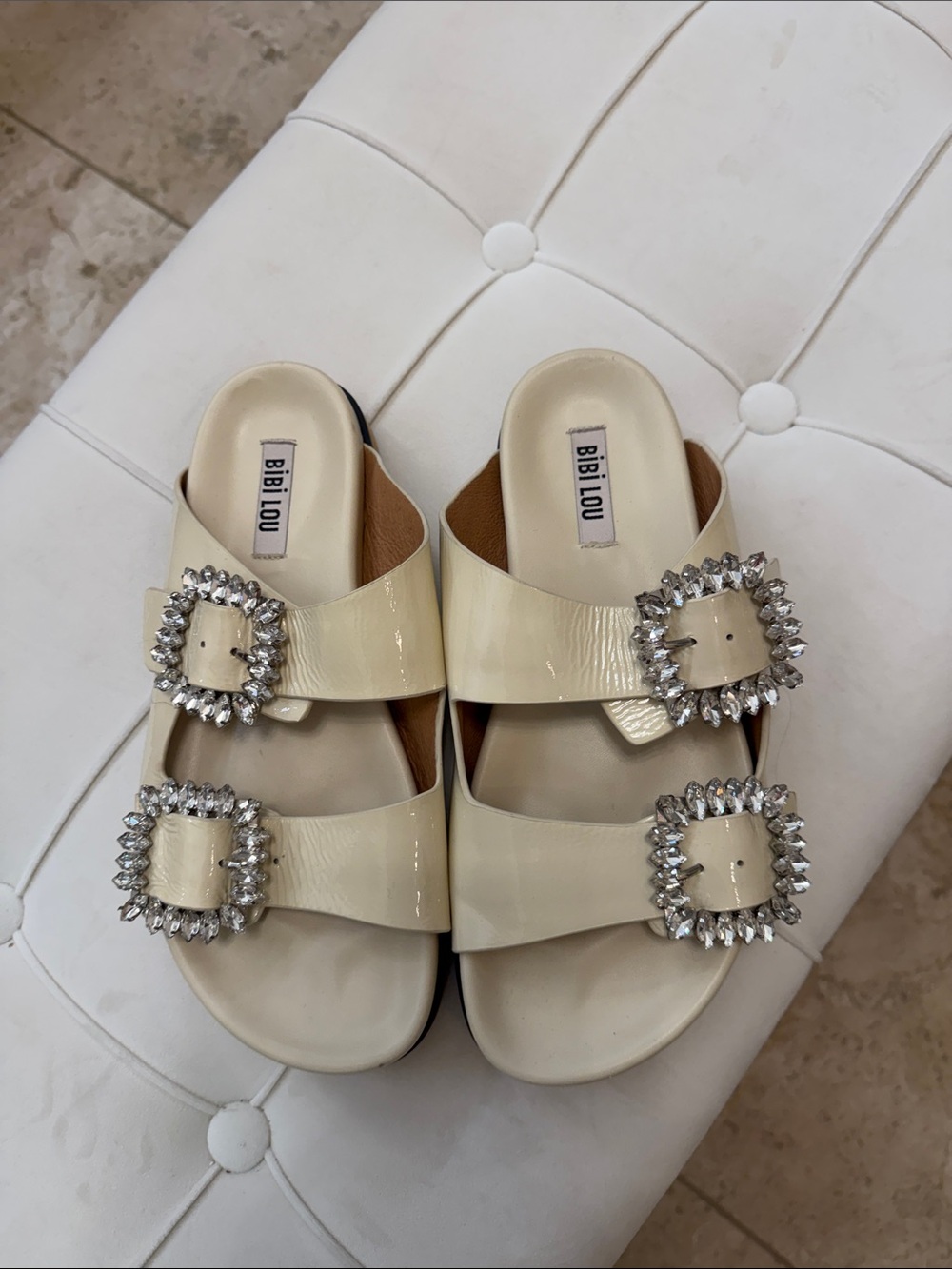 Bibi Lou Cream Patent Double-Buckle Slide Sandals with Crystal Buckles